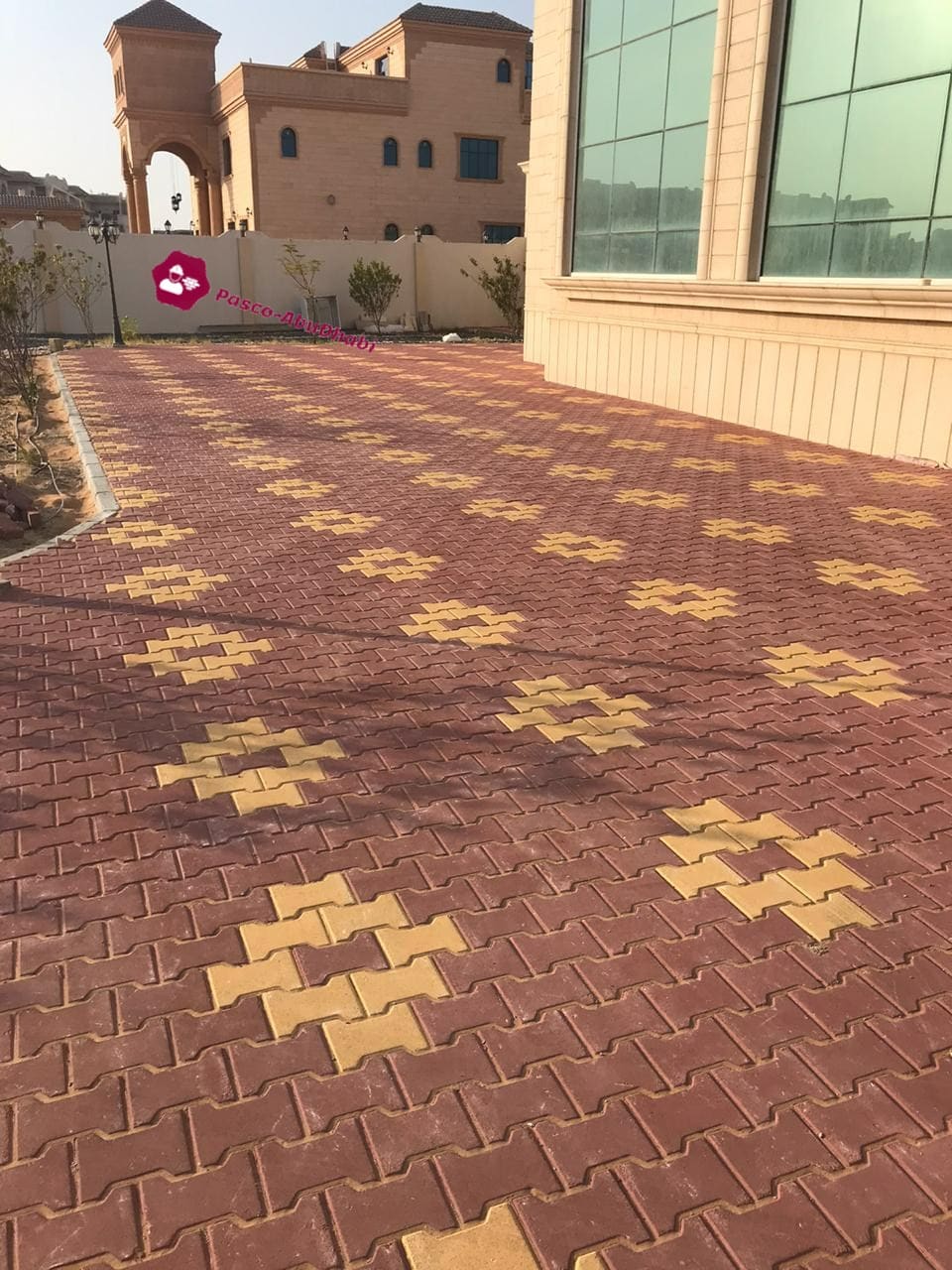 Villa courtyard with red and yellow Behaton pavers